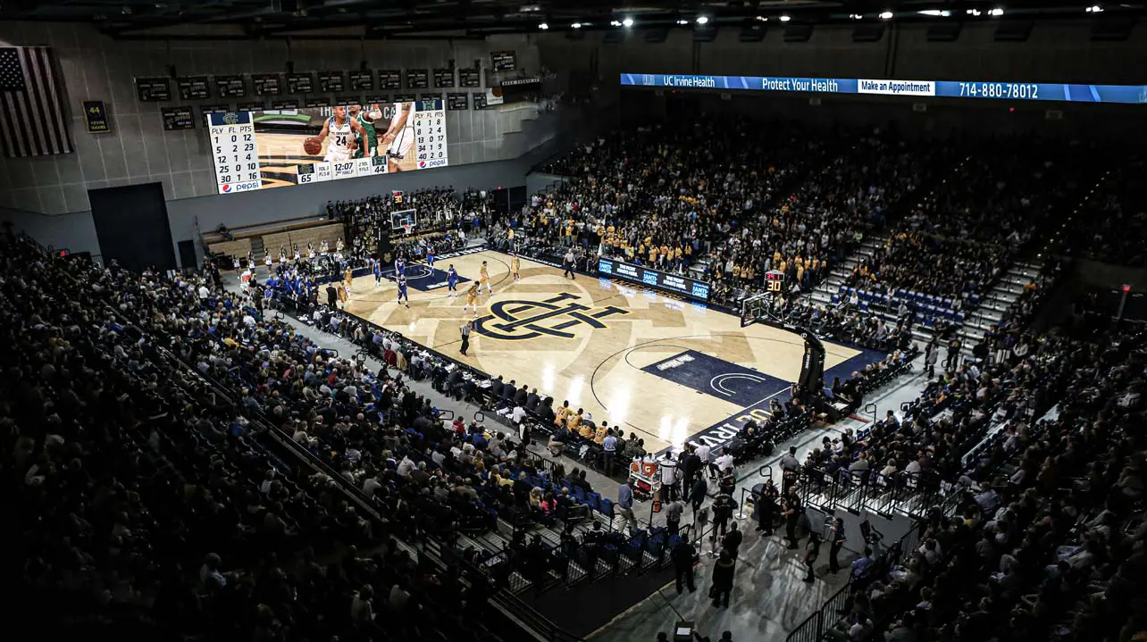 Aerial view of packed arena during basketball game